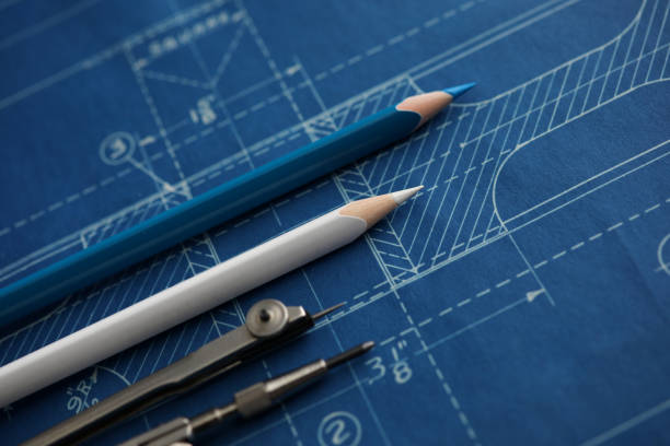 Blueprint and drafting tools illustrating the intersection of fashion design and architectural planning.